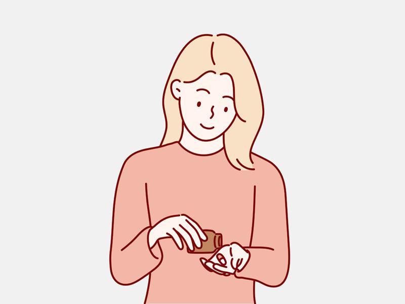 ビタミン剤やサプリメントを出して服用している女性のイラスト